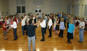 Andrew Weitzen leading folk dancing in Gainesville at the Thelma Boltin Center